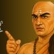 Acharya Chanakya standing with a young boy beside him holding a trophy, symbolizing success and guidance.