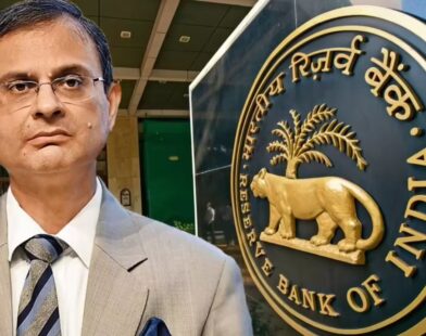 RBI Governor Sanjay Malhotra standing, with the Reserve Bank of India logo visible on the other side.