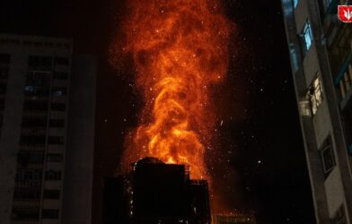 Massive fire in Hong Kong multistorey buildings with smoke and rescue operations in progress