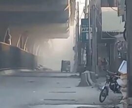 FC headquarters in Peshawar with smoke rising after suicide blasts and heavy gunfire by attackers