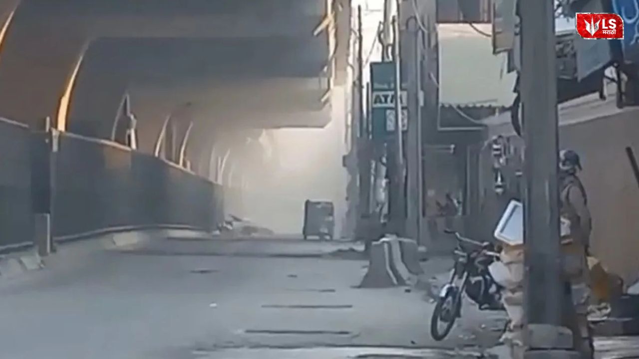 FC headquarters in Peshawar with smoke rising after suicide blasts and heavy gunfire by attackers