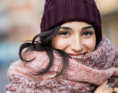 Person sleeping in winter while wearing ear caps, showing effects on health and comfort