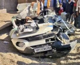 Overturned dumper lying on top of a crushed car after a tragic accident killing seven family members