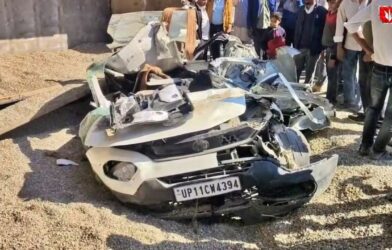 Overturned dumper lying on top of a crushed car after a tragic accident killing seven family members