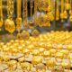Gold jewellery displayed in a showroom as gold prices rise during the wedding season