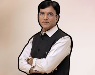 Union Labour Minister Mansukh Mandaviya standing and addressing the media