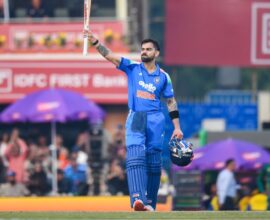 Virat Kohli celebrating after scoring a record-breaking century in the Ranchi ODI, achieving multiple cricket records