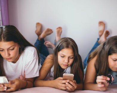 Illustration showing a smartphone with a “No Social Media under 16” sign, representing Australia’s ban on social media for children below 16 years