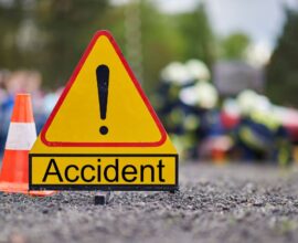 Scene of a serious road accident on the Dhule–Solapur Highway showing damaged vehicles, with reports of one person dead and another critically injured