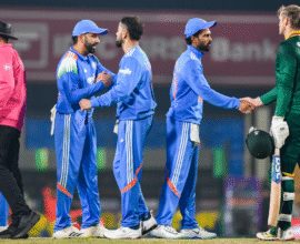Rohit Sharma and Virat Kohli standing on the cricket field ahead of the India vs South Africa 2nd ODI match