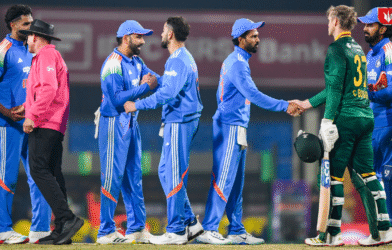 Rohit Sharma and Virat Kohli standing on the cricket field ahead of the India vs South Africa 2nd ODI match