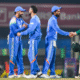 Rohit Sharma and Virat Kohli standing on the cricket field ahead of the India vs South Africa 2nd ODI match