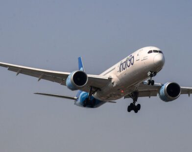 IndiGo aircraft at the airport with passengers affected by flight cancellations and refund delays