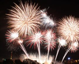 Family celebrating New Year 2026 at home with decorations and lights
