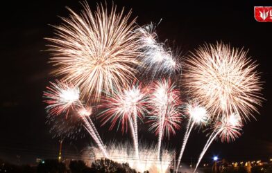 Family celebrating New Year 2026 at home with decorations and lights