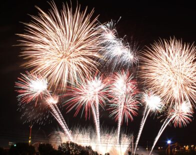 Family celebrating New Year 2026 at home with decorations and lights