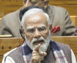 He is criticizing Congress on the issue of Vande Mataram