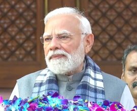 Prime Minister Narendra Modi arriving at the Indian Parliament during the winter session, greeting members and media
