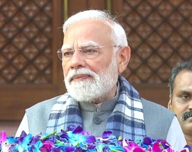 Prime Minister Narendra Modi arriving at the Indian Parliament during the winter session, greeting members and media
