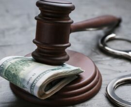 Anti-Corruption Bureau officers in Pune detaining two suspects in an ₹8 crore bribe case