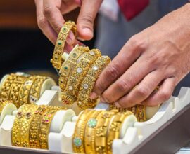 Silver bars and gold coins representing the latest record-breaking price surge