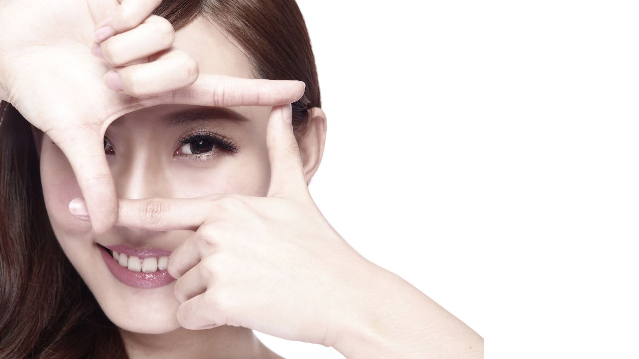 Woman applying eye cream during winter for dry eye prevention and healthy eyes
